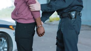 Officer arresting someone for ecstasy possesion